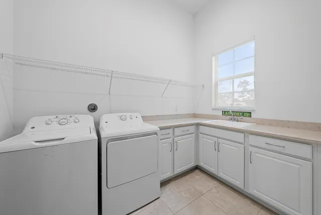 an aerial view of a house with outdoor space and lake view