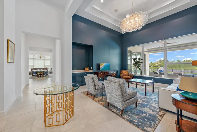 a kitchen with stainless steel appliances granite countertop a sink a stove and white cabinets