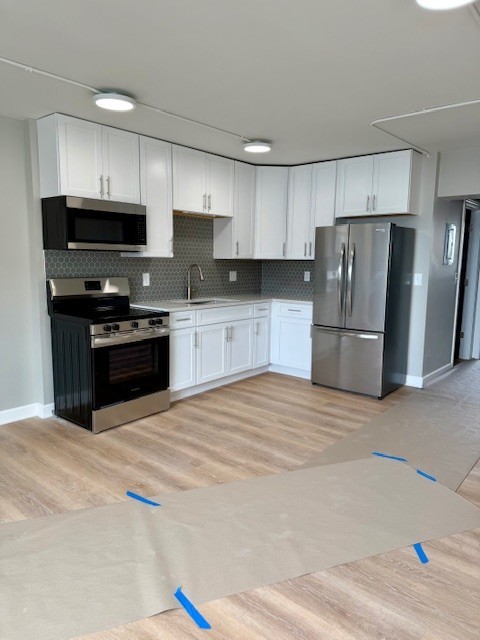 29837 Highway 50, Unit 24 Peotone, IL 60468 - Photo 3 of 13 a kitchen with stainless steel appliances granite countertop a refrigerator sink and stove
