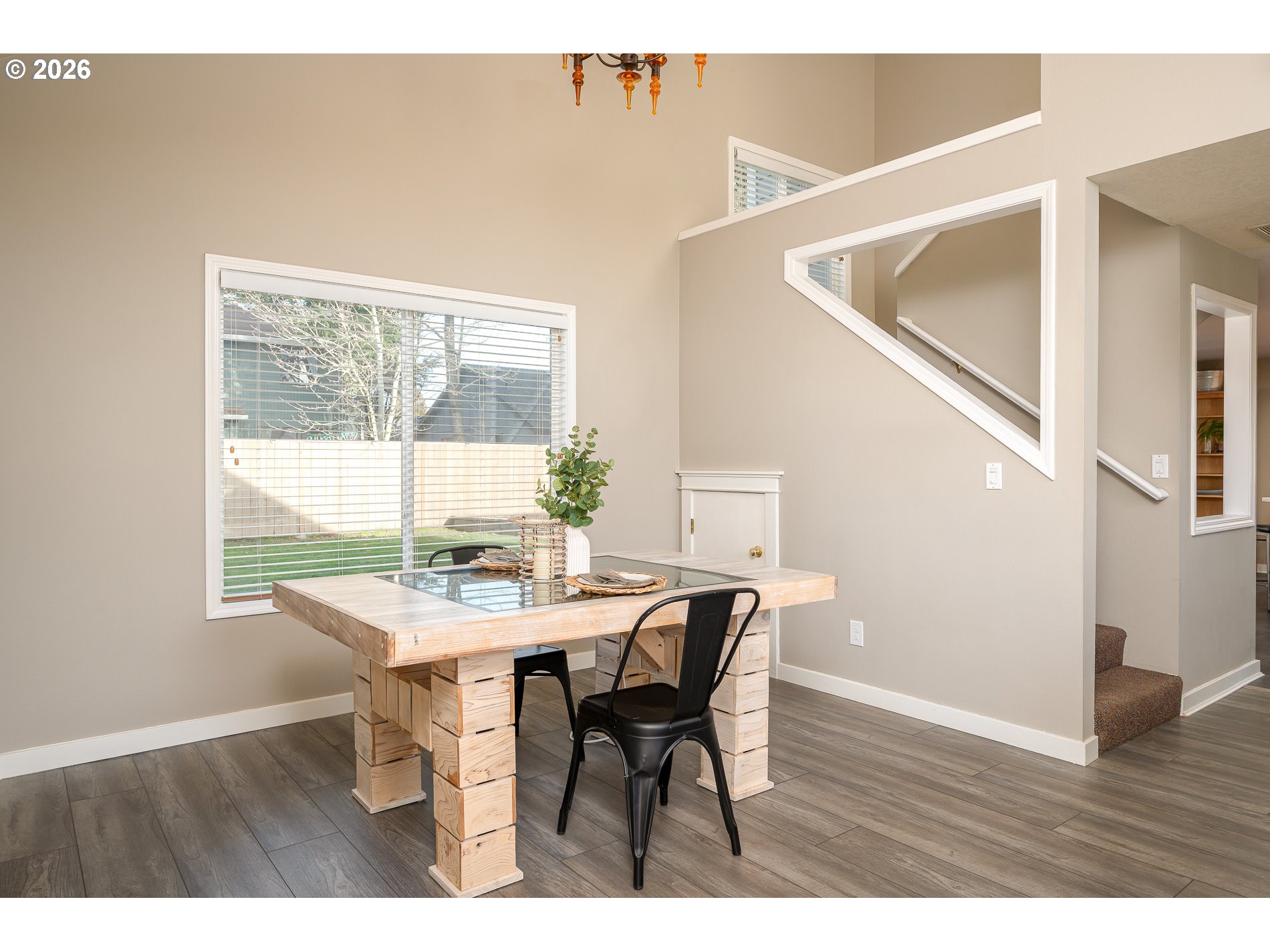 8670 Southwest Stratford Court Tigard, OR 97224 - Photo 13 of 42 a view of a dining room with furniture and wooden floor