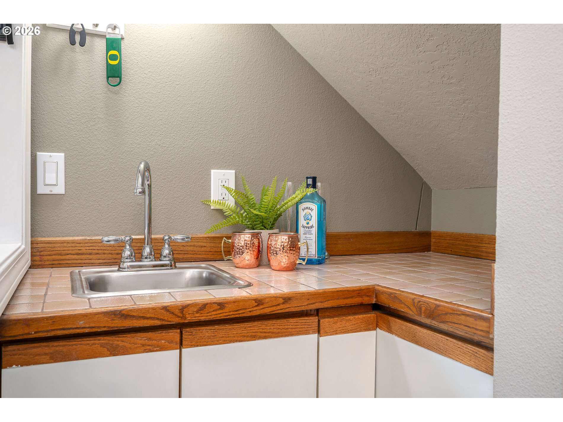 8670 Southwest Stratford Court Tigard, OR 97224 - Photo 18 of 42 a bathroom with a sink and a mirror