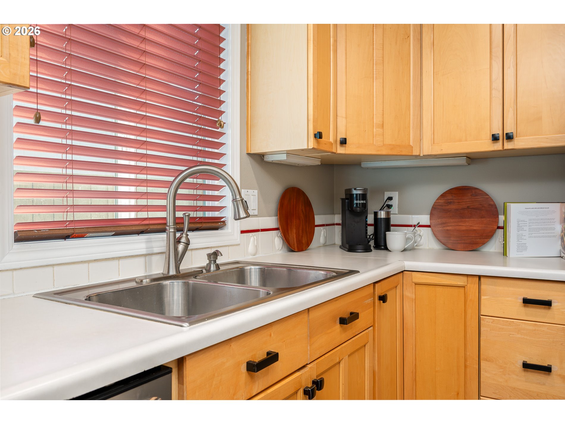 8670 Southwest Stratford Court Tigard, OR 97224 - Photo 24 of 42 a kitchen with sink and cabinets