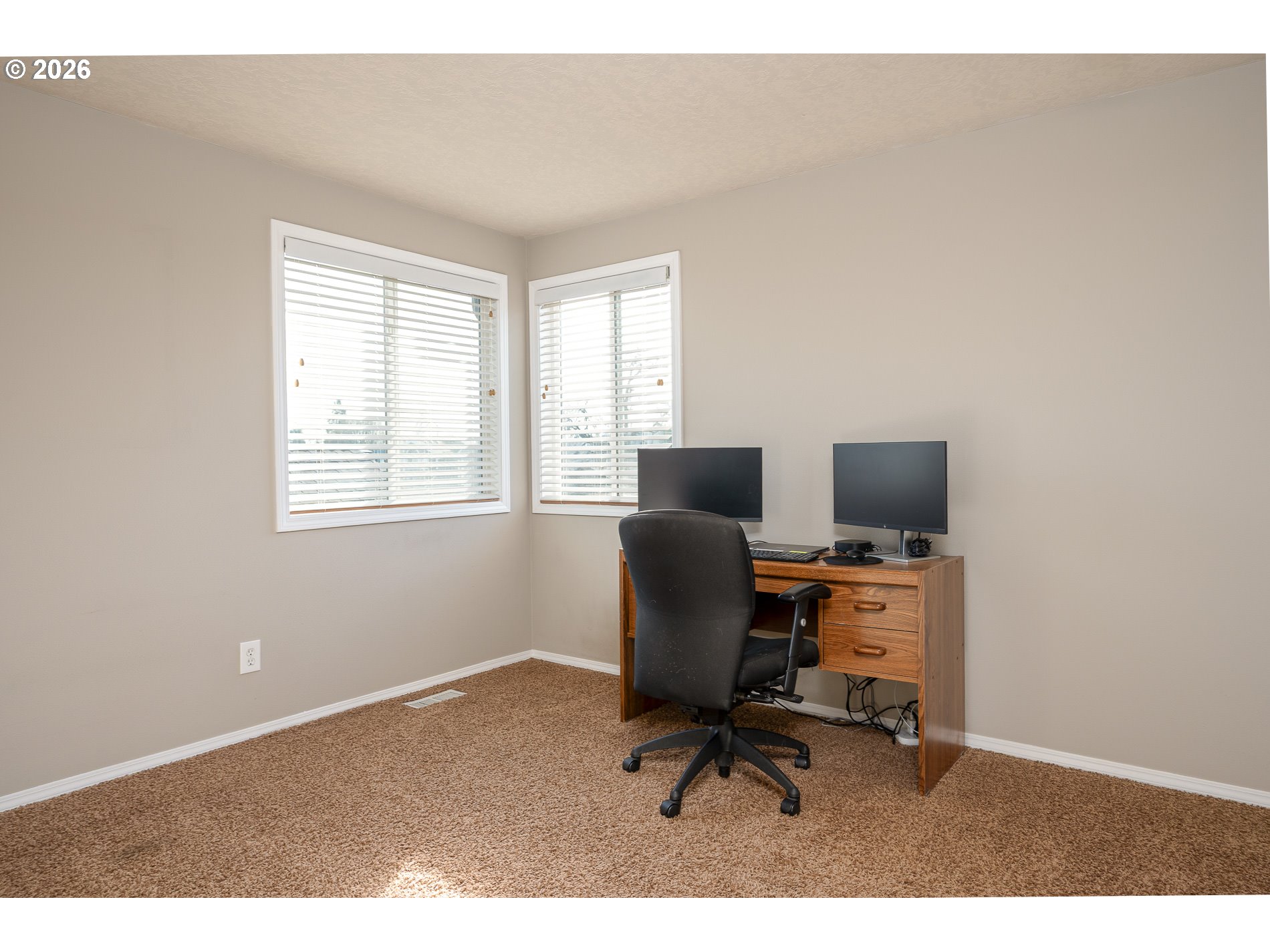 8670 Southwest Stratford Court Tigard, OR 97224 - Photo 29 of 42 a view of a workspace with furniture and a window