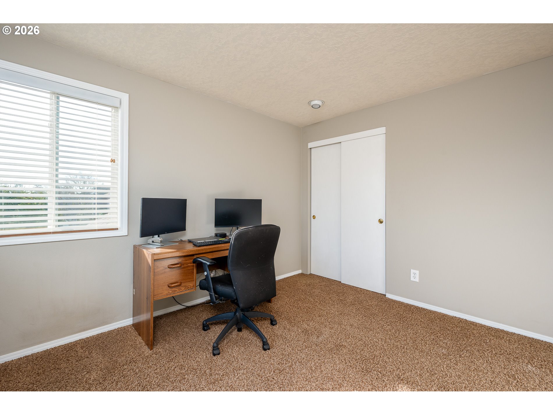 8670 Southwest Stratford Court Tigard, OR 97224 - Photo 30 of 42 a view of a workspace with furniture and a window