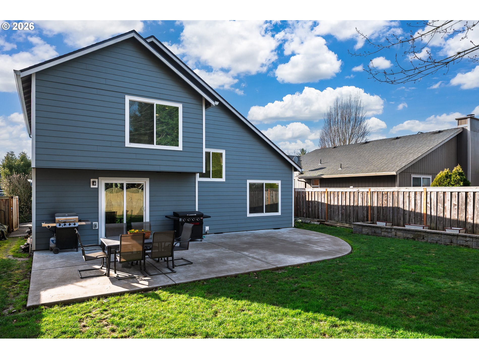 8670 Southwest Stratford Court Tigard, OR 97224 - Photo 35 of 42 a view of a house with a yard and sitting area