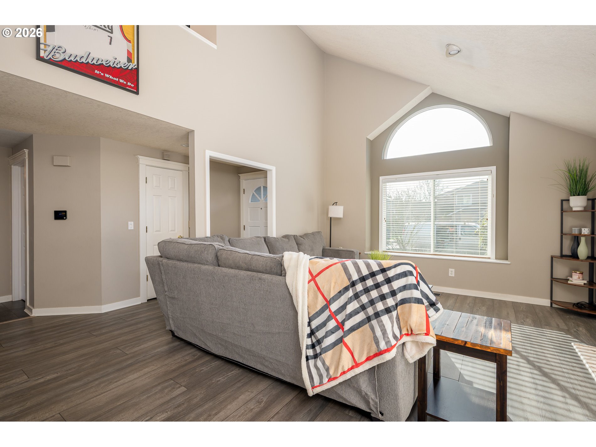 8670 Southwest Stratford Court Tigard, OR 97224 - Photo 10 of 42 a living room with a bed and a dresser next to a window