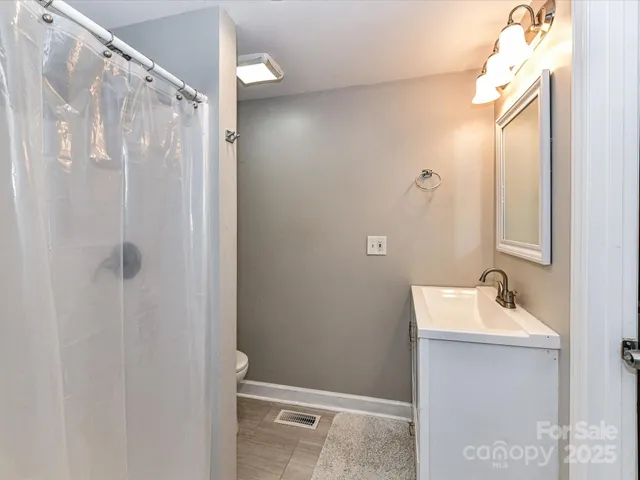 a bathroom with a sink and shower