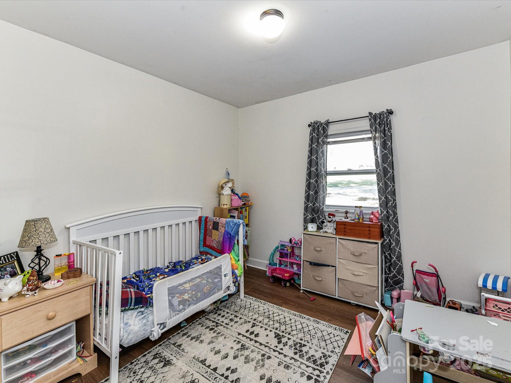 1620 Blueberry Street Mount Pleasant, NC 28124 - Photo 20 of 31 a bedroom with furniture and a window