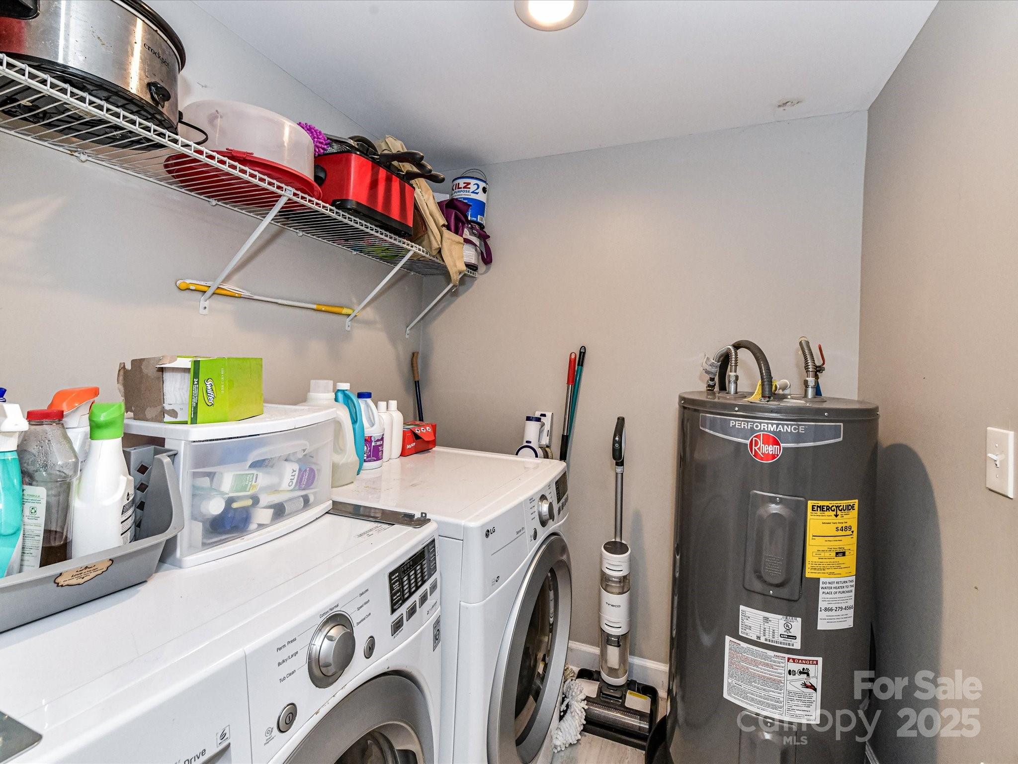 1620 Blueberry Street Mount Pleasant, NC 28124 - Photo 26 of 31 a utility room with dryer washer and a wooden floors