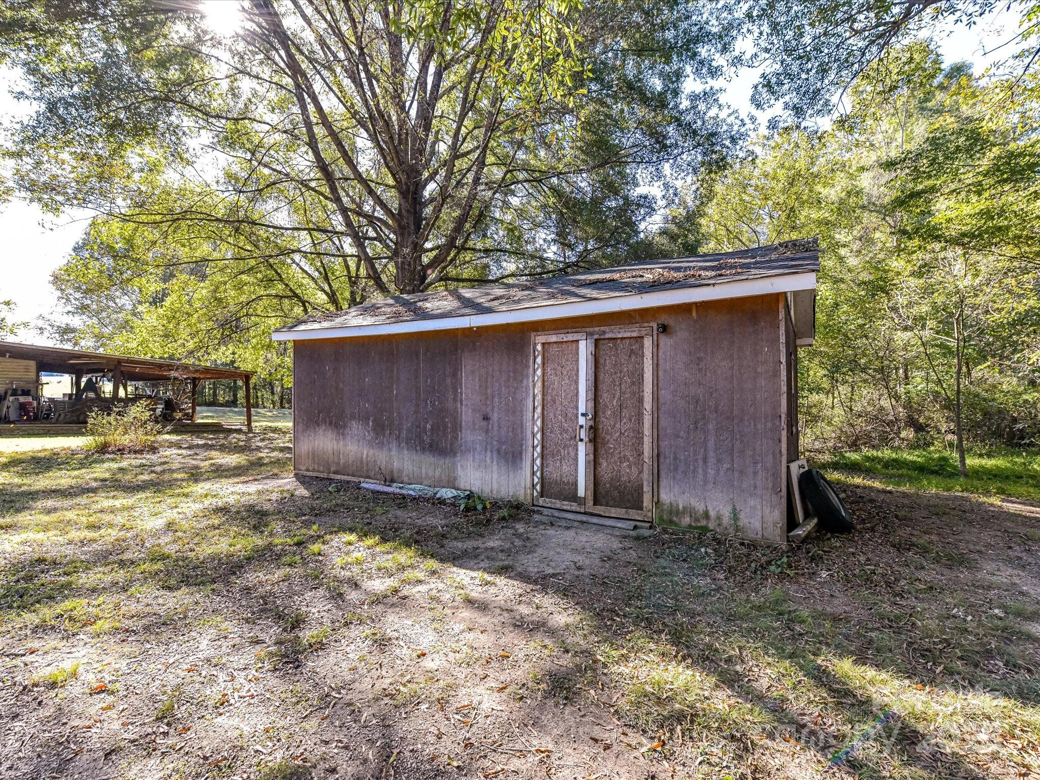 1620 Blueberry Street Mount Pleasant, NC 28124 - Photo 28 of 31 a view of a barn in the middle of a yard