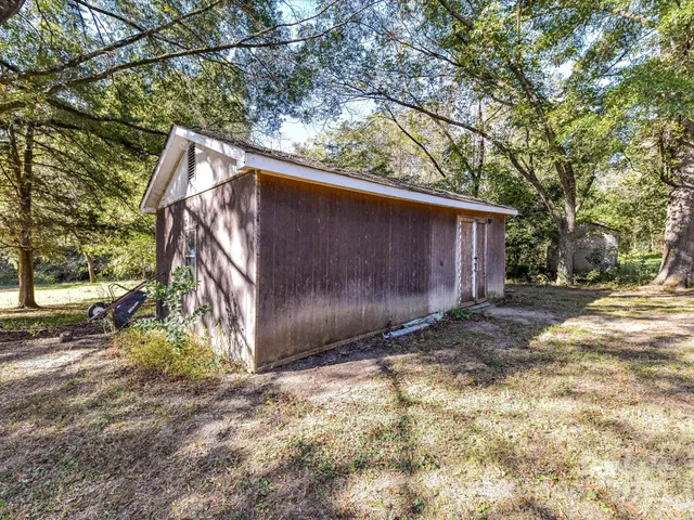 a backyard of a house with lots of green space