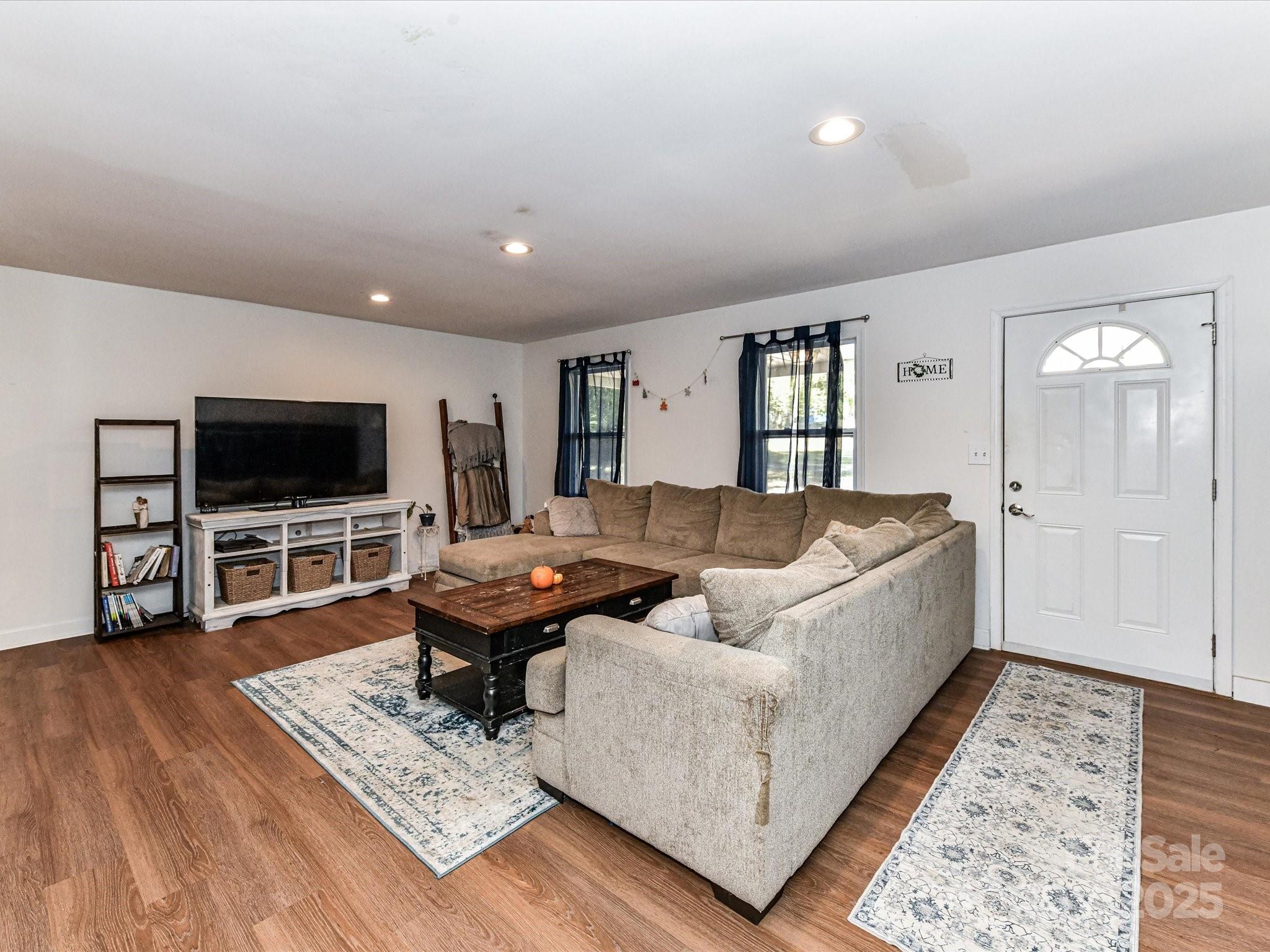 1620 Blueberry Street Mount Pleasant, NC 28124 - Photo 10 of 31 a living room with furniture and a flat screen tv
