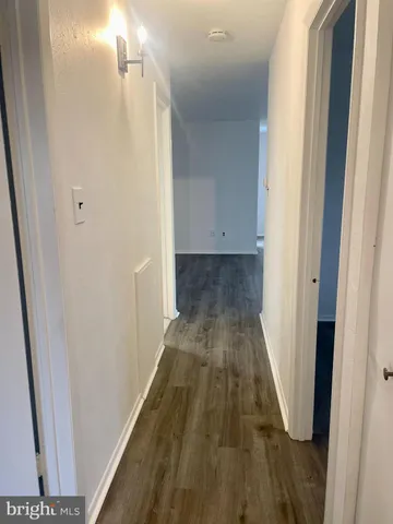 a view of a bathroom with mirror and a shower