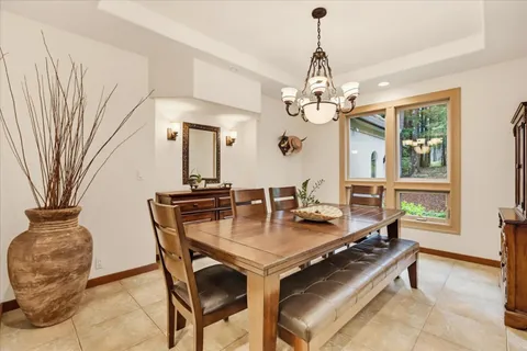 a dining room with furniture and window