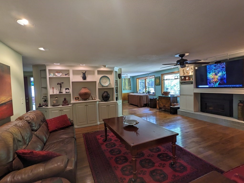 169 West Autumn Road West Springfield, MA 01089 - Photo 12 of 27 a living room with furniture a fireplace and a flat screen tv