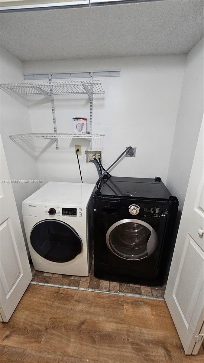 801 Lyons Road, Unit 19203 Coconut Creek, FL 33063 - Photo 15 of 28 a bathroom with a toilet and a mirror