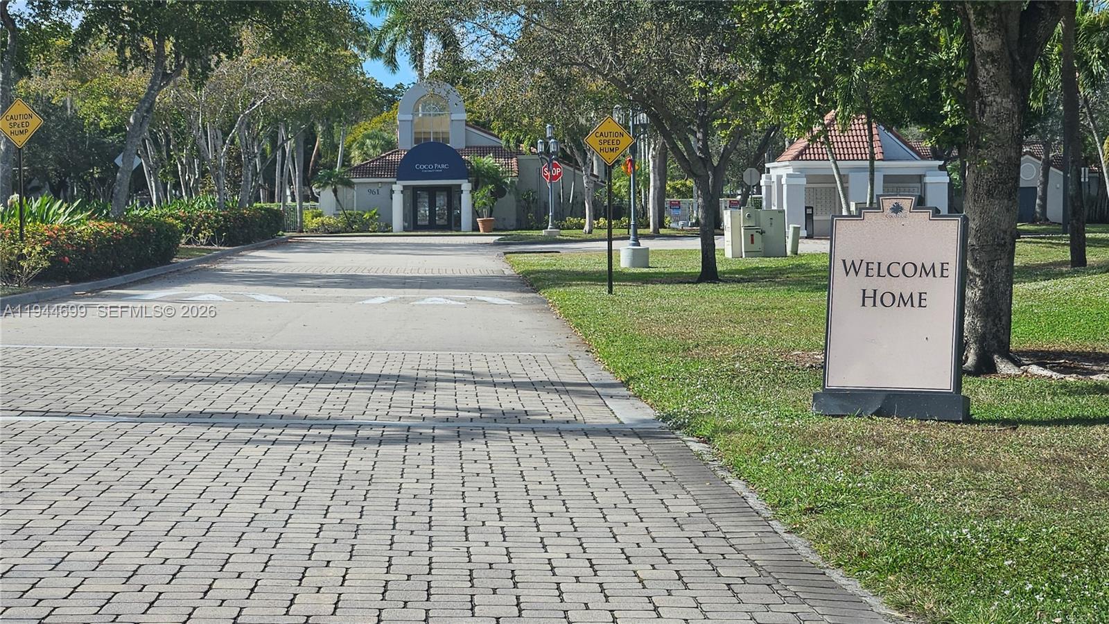 801 Lyons Road, Unit 19203 Coconut Creek, FL 33063 - Photo 2 of 28 a front view of a house with a yard