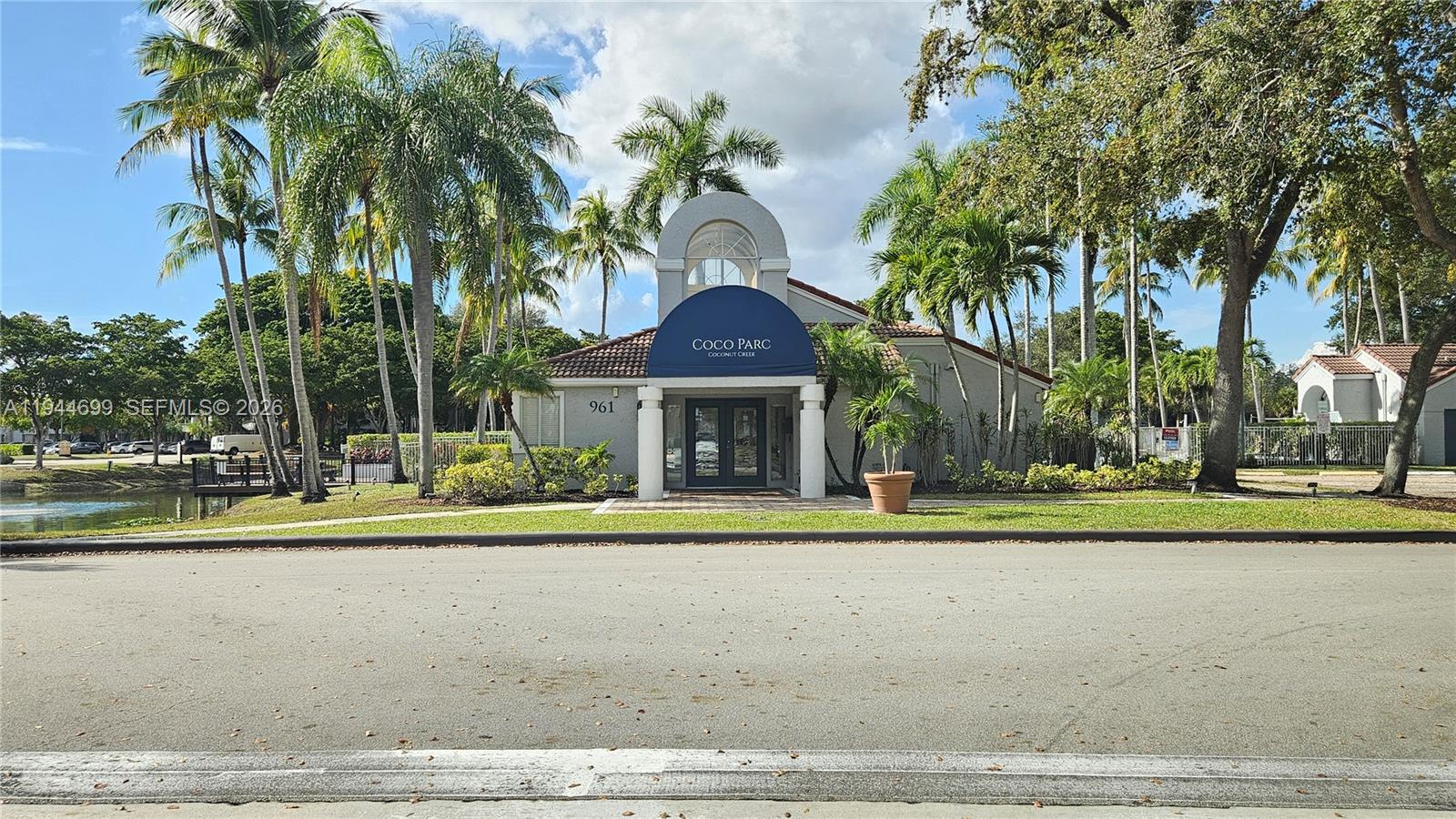 801 Lyons Road, Unit 19203 Coconut Creek, FL 33063 - Photo 26 of 28 a view of a volley ball court