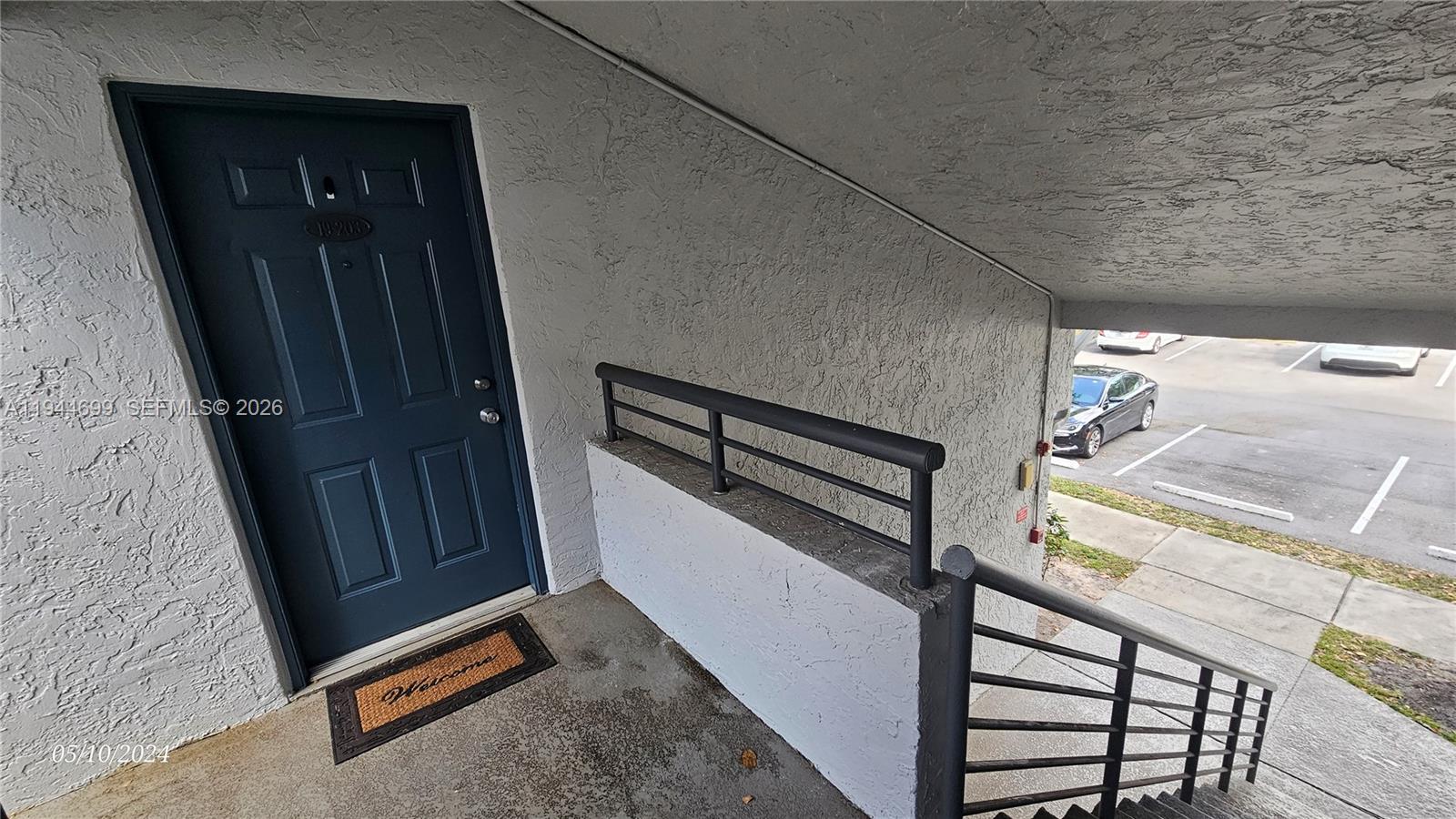 801 Lyons Road, Unit 19203 Coconut Creek, FL 33063 - Photo 4 of 28 a view of a staircase