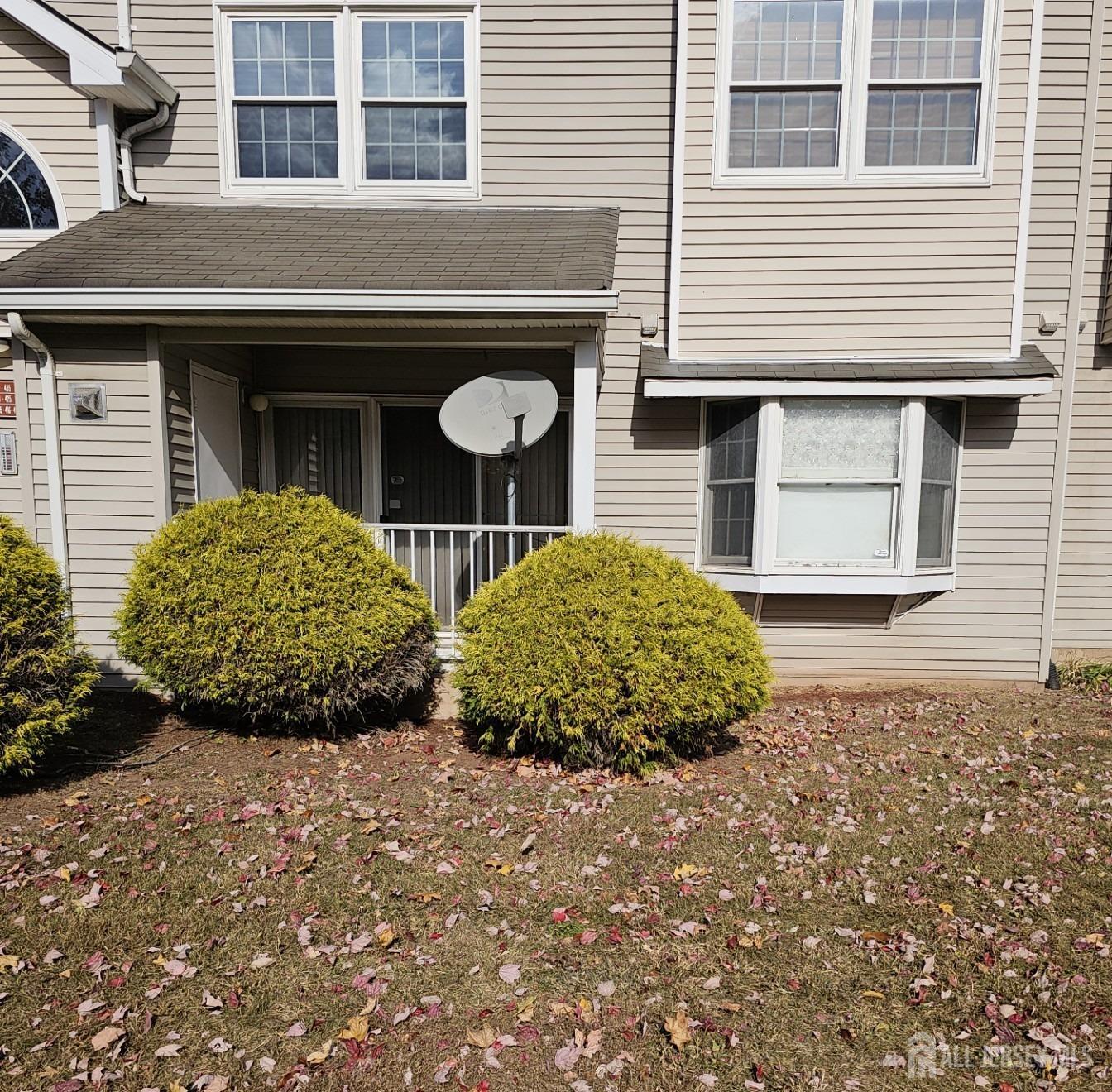 414 Edpas Road New Brunswick, NJ 08901 - Photo 1 of 11 a couple of potted plants in front of a house