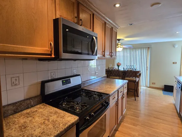 a kitchen with a stove and a microwave