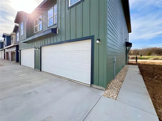 a view of a street with brick wall