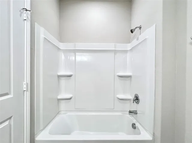 a view of a utility room with baby closet