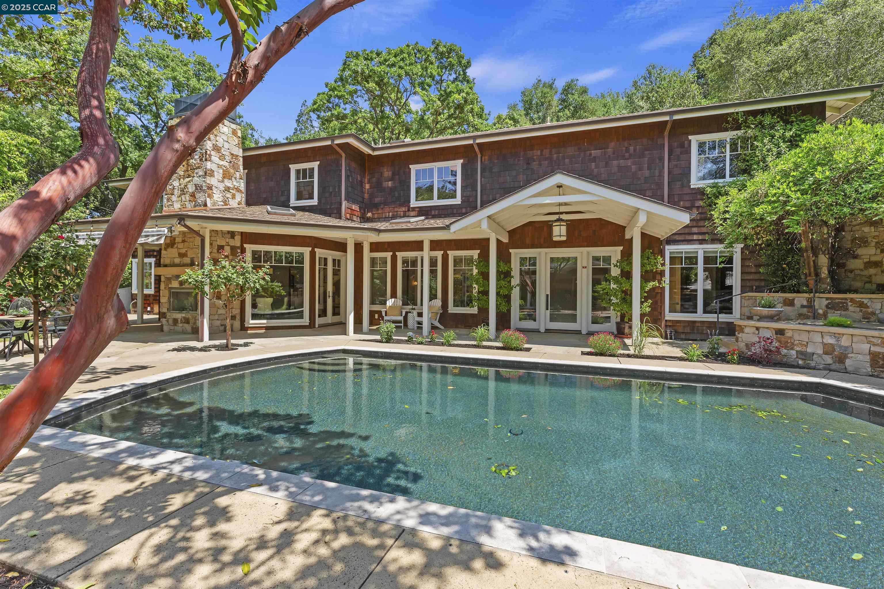 a view of a house with a swimming pool