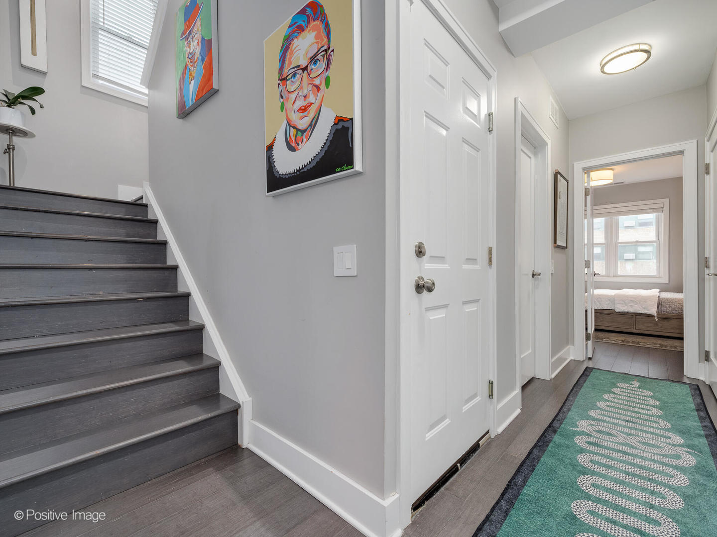 1846 North Mohawk Street, Unit PH Chicago, IL 60614 - Photo 17 of 37 a view of a hallway with paintings on the wall