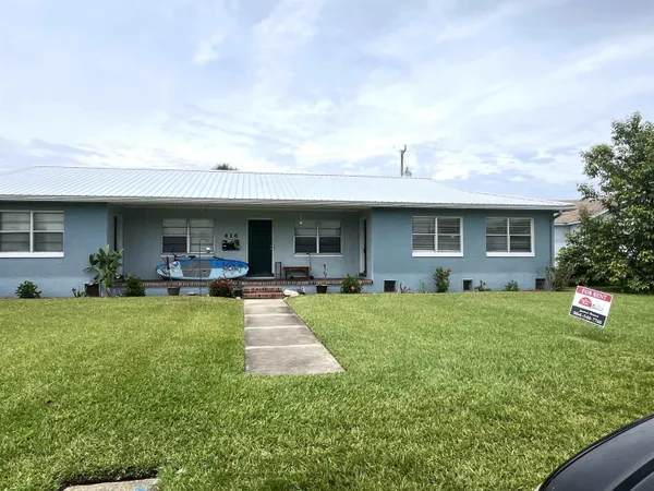 a front view of house with yard and seating area