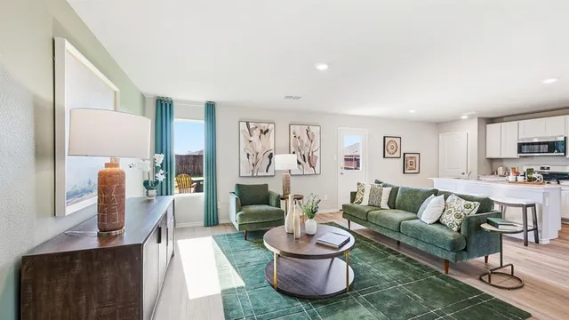 a dining room with furniture a mirror and a table