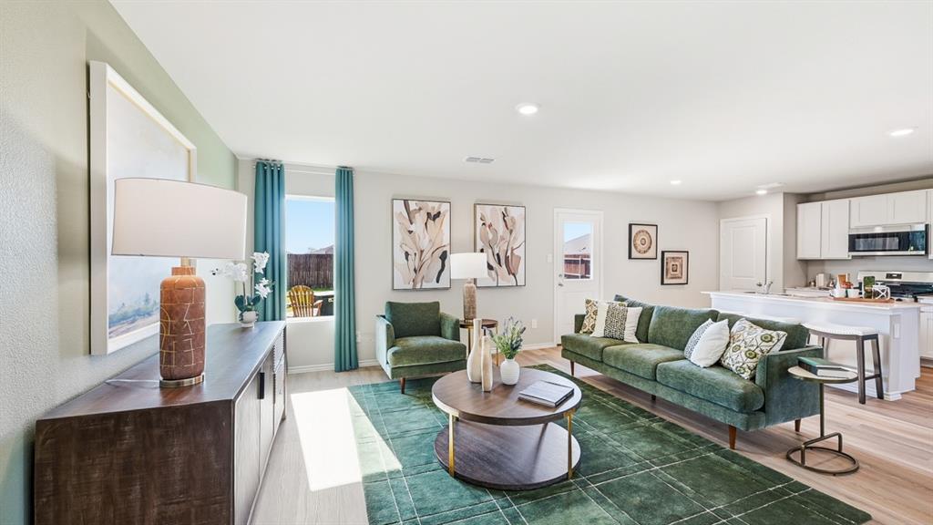 5512 Corduroy Road Krum, TX 76249 - Photo 10 of 38 a living room with furniture and a view of kitchen