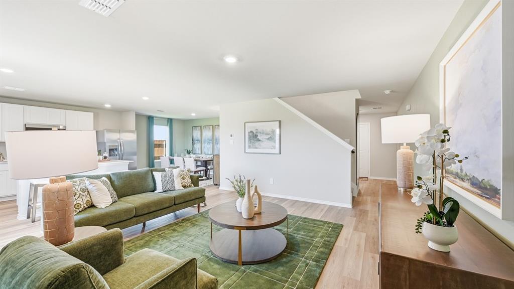 5512 Corduroy Road Krum, TX 76249 - Photo 11 of 38 a living room with furniture and a wooden floor