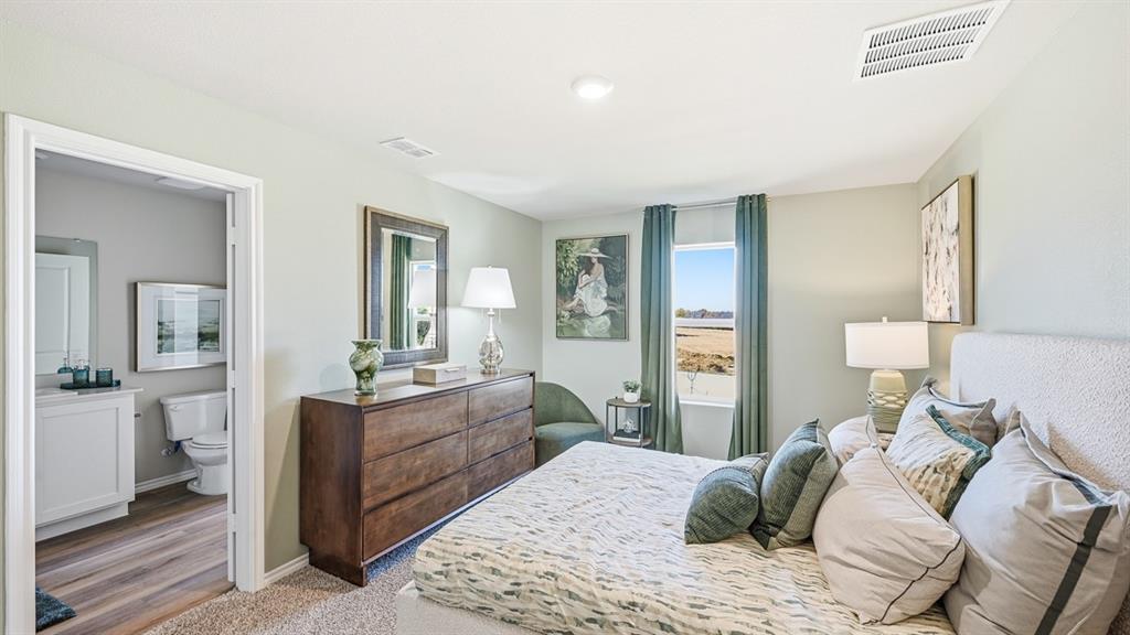 5512 Corduroy Road Krum, TX 76249 - Photo 14 of 38 a bedroom with a bed and a couch