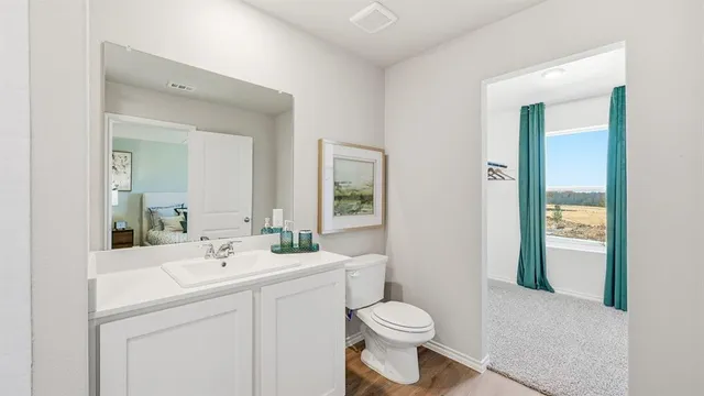 a bedroom with a bed and a lamp on table