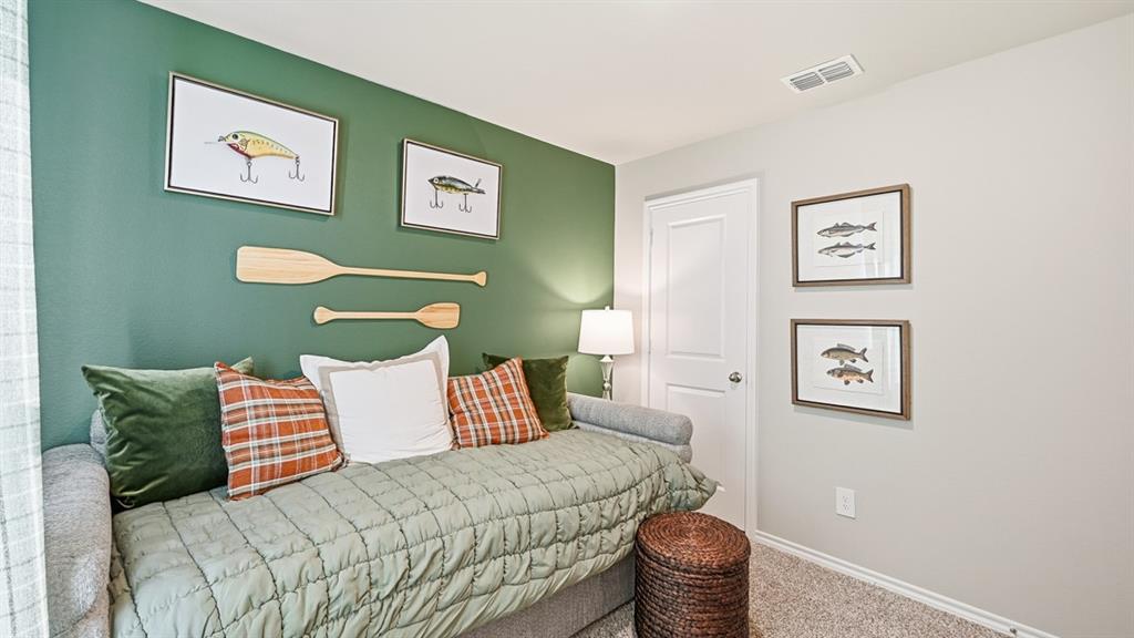 5512 Corduroy Road Krum, TX 76249 - Photo 25 of 38 a bedroom with a bed and painting on the wall