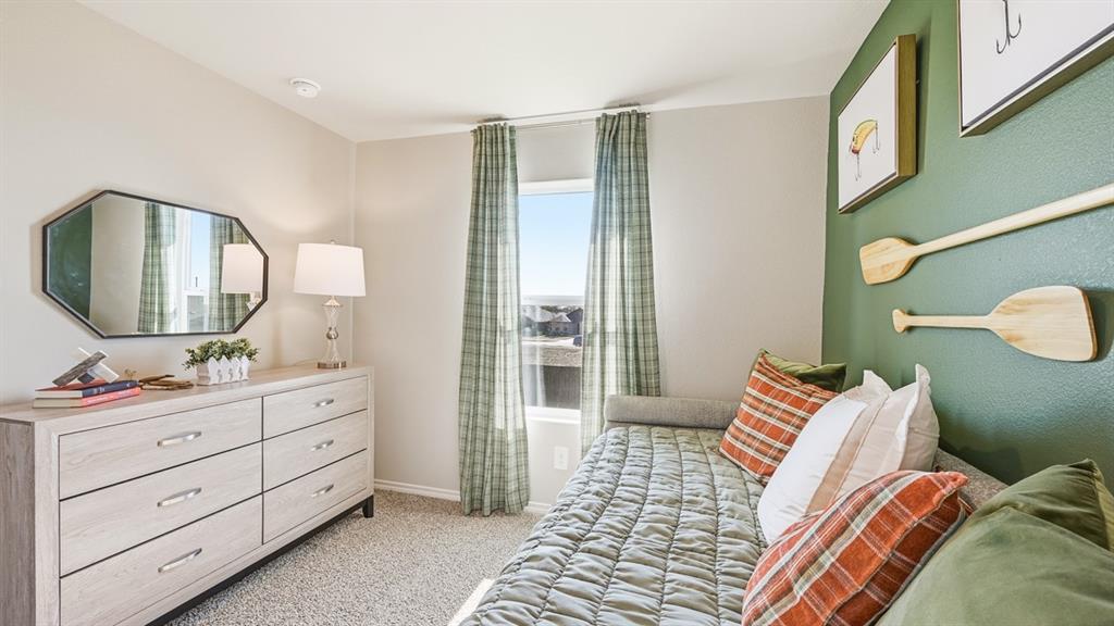 5512 Corduroy Road Krum, TX 76249 - Photo 27 of 38 a bedroom with a bed and wooden floor