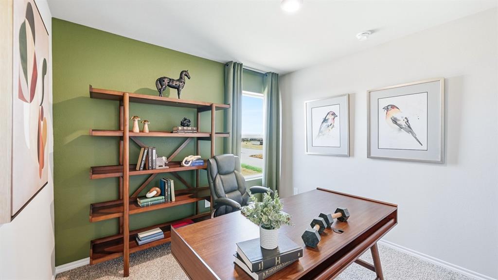 5512 Corduroy Road Krum, TX 76249 - Photo 28 of 38 a living room with furniture and a bookshelf