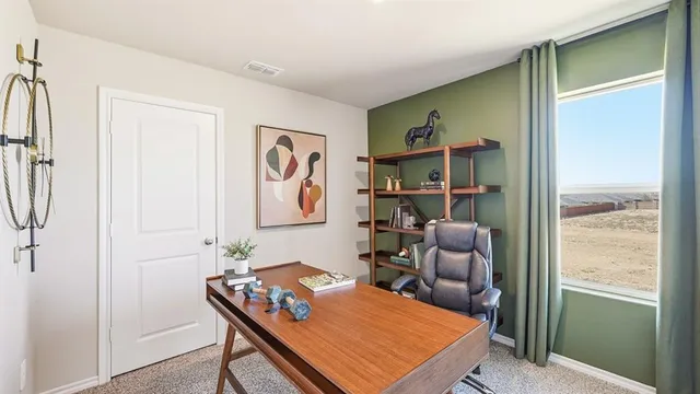 a living room with furniture and a bookshelf