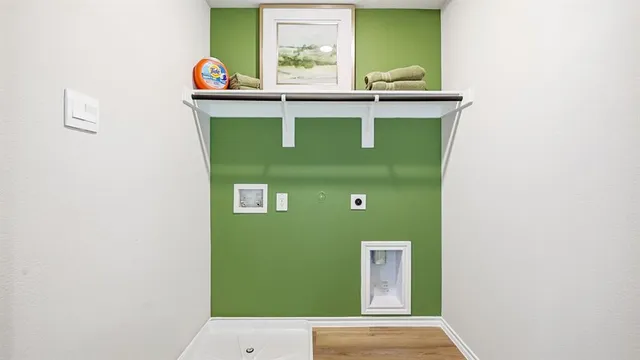 a view of a workspace room with furniture and mirror