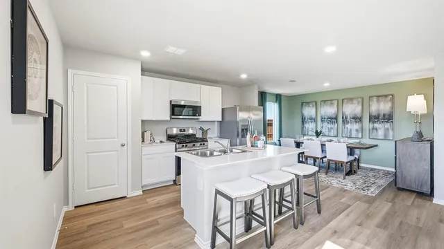 a view of a room with wooden floor