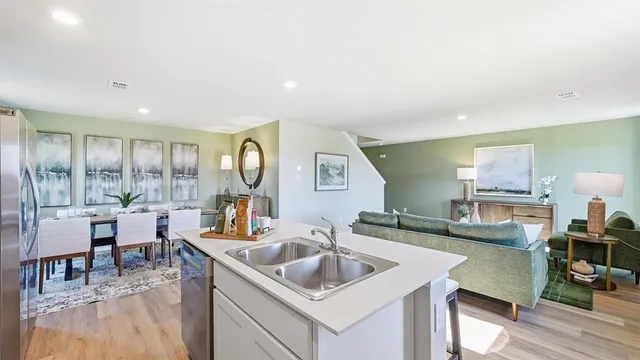 a kitchen with microwave a stove and cabinets
