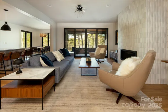 a large bedroom with a large bed and a potted plant