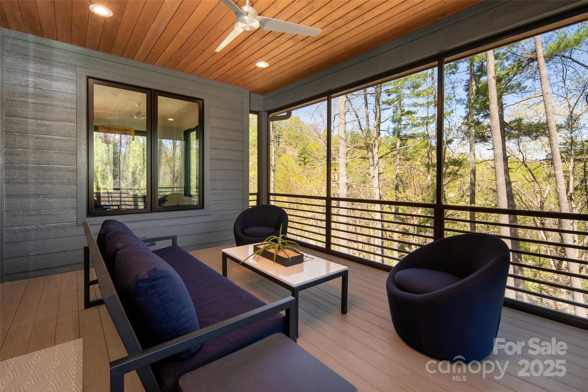 42 Spring Cove Road Asheville, NC 28804 - Photo 18 of 43 a living room with furniture and a large window