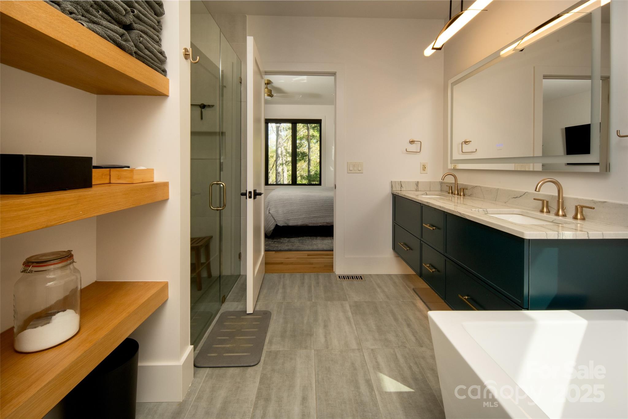 42 Spring Cove Road Asheville, NC 28804 - Photo 23 of 43 a en suite bathroom with a sink and a mirror
