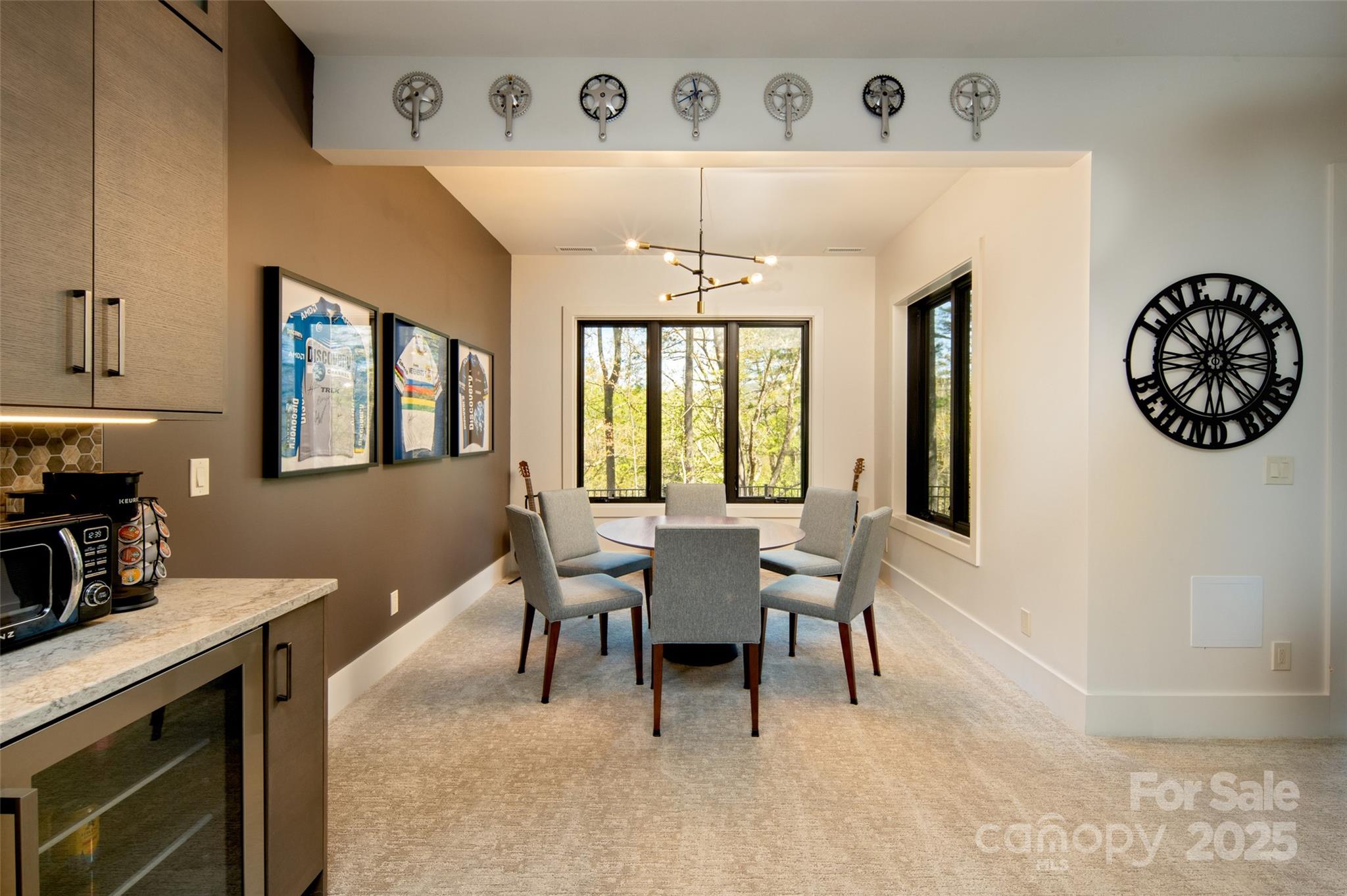 42 Spring Cove Road Asheville, NC 28804 - Photo 35 of 43 a dining room with wooden floor a chandelier a wooden table and chairs