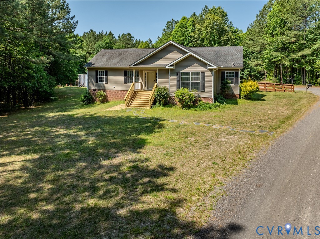 8025 Colemans Lake Road Church Road, VA 23850 - Photo 19 of 21 a front view of a house with yard and green space