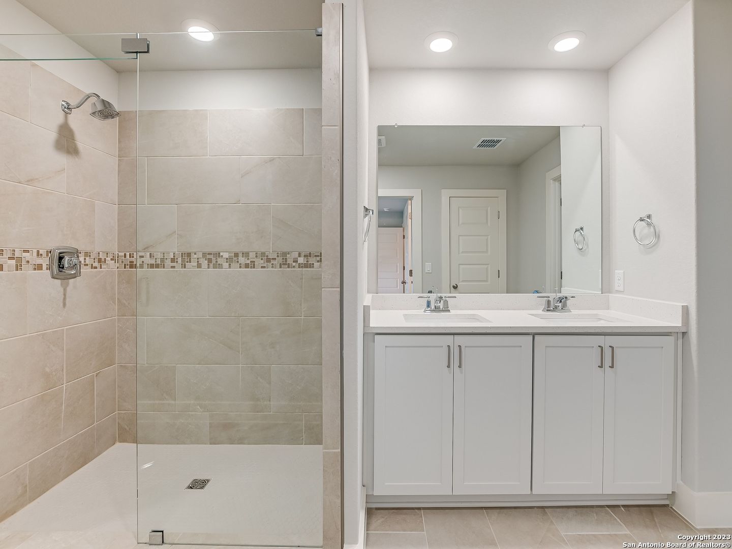 16011 Babcock Road, Unit 22 San Antonio, TX 78255 - Photo 12 of 20 a bathroom with a shower sink and mirror