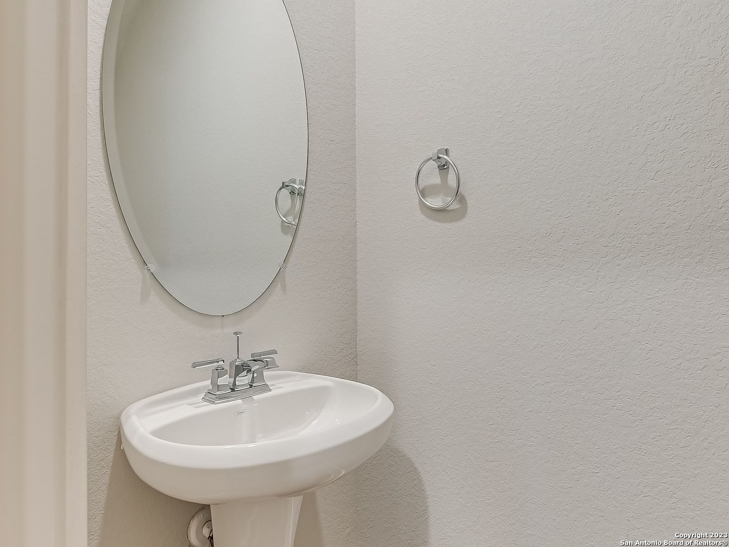 16011 Babcock Road, Unit 22 San Antonio, TX 78255 - Photo 18 of 20 a bathroom with a sink and a mirror