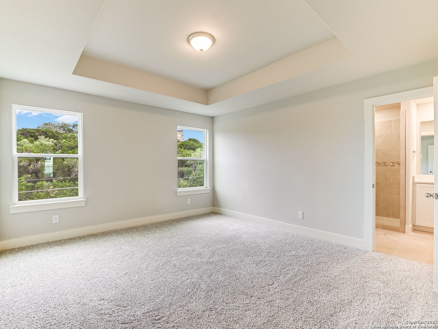 16011 Babcock Road, Unit 22 San Antonio, TX 78255 - Photo 9 of 20 an empty room with windows